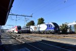 Charger # 2106 pushes Amtrak Train # 542 toward the next stop of Santa Clara University while Caltrain # 140 is about to make its station stop.